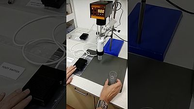 Automated dispensing of powder portions with DOSER and foot-switch in lab